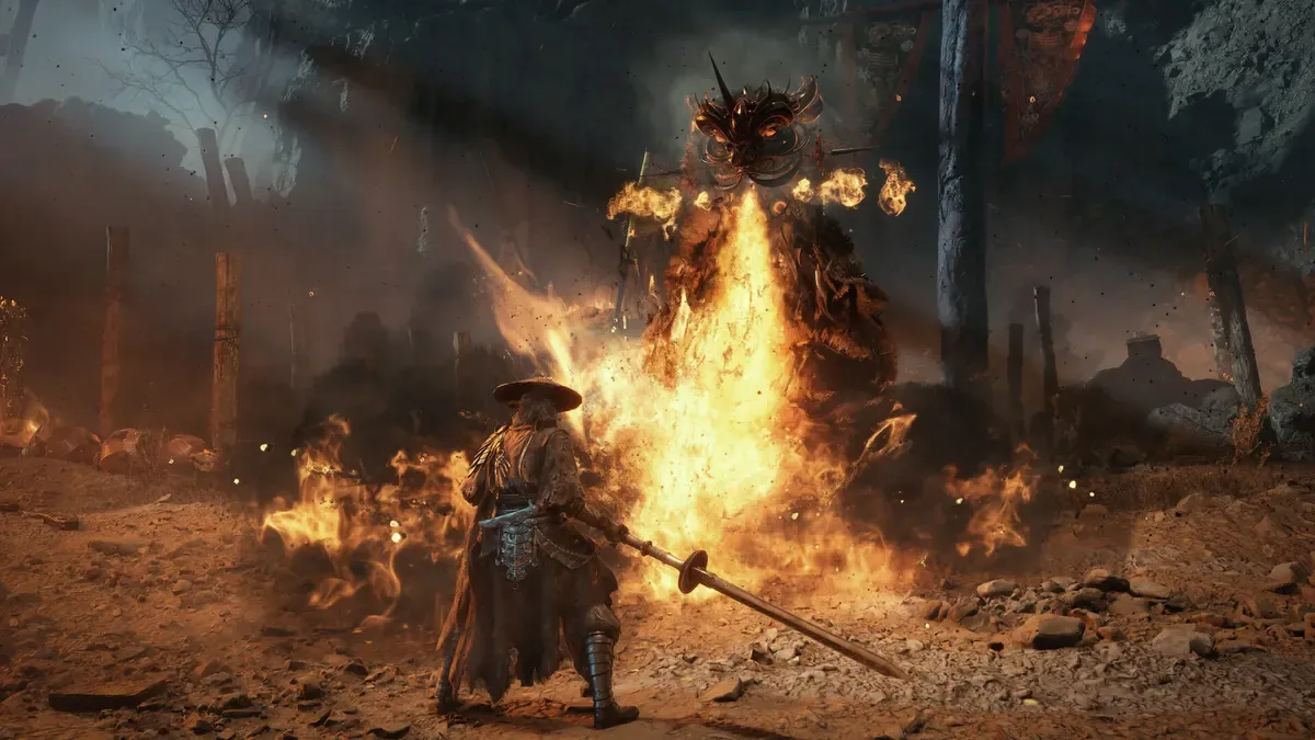 Soul facing a flame-wreathed boss across a burning arena in Phantom Blade Zero